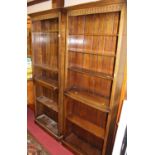 A pair of Kennedy of Ipswich joined oak freestanding open bookshelves, each having fixed centre
