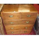 A hardwood military style chest of two short over three long drawers, comprised of two sections with