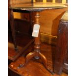 A mid-Victorian figured walnut and floral satin wood inlaid circular fixed top pedestal tripod