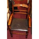 A pair of 17th century style oak ladder back elbow chairs, having tan leather studded pad seats,