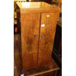 A 1950s figured walnut low narrow double door record cabinet by The Northampton Cabinet Company,