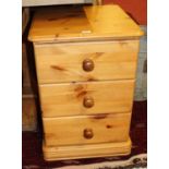 A modern pine round cornered three drawer bedside chest, width 44cm