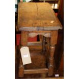 An 18th century joined oak joint stool, raised on ring turned and square cut supports, width 46cm
