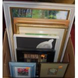 A box of assorted pictures and prints