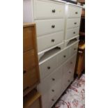 A contemporary white wood round cornered side chest comprising three short drawers over six