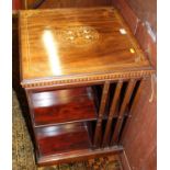 A good circa 1900 mahogany, satinwood and ivory inlaid revolving bookcase by Maple & Co. having
