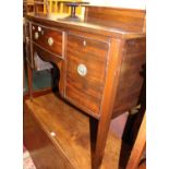 A 19th century mahogany bowfront kneehole sideboard, the single central drawer flanked by hinged