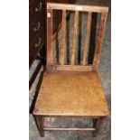 Four matched 19th century provincial elm and oak slatback panelled seat dining chairs, and one other