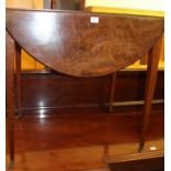 A Regency mahogany pembroke table having single end drawer, oval full leaves raised on square