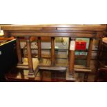 A 19th century walnut draw-leaf dining table, raised on plain turned columns to thumb moulded