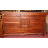 A contemporary Lexington cherrywood sideboard, fitted with nine various drawers and central cupboard