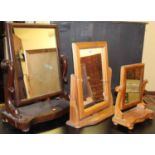 A Victorian mahogany swing toilet mirror, together with a further pine swing dressing mirror, and