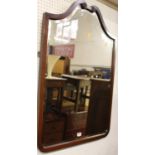 A circa 1900 mahogany framed bevelled shaped wall mirror, 91.5 x 65.5cm