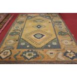 A Turkaman Oriental carpet, being Egyptian machine made, having a beige ground with linked