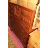 A contemporary Lexington joined cherrywood tallboy chest, having a small central upper cupboard