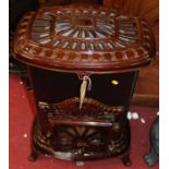 An early 20th century enamelled cast iron freestanding cathedral heater, having rounded corners