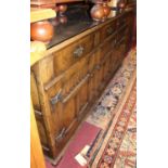 A good contemporary joined and moulded oak dresser base, having three frieze drawers over relief