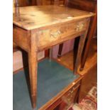 An early 19th century provincial joined oak plank top single drawer side table, raised on square