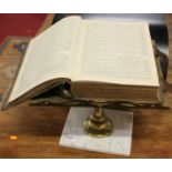 A Victorian brass lectern, on veined white marble plinth, w.40cm; together with a Victorian family