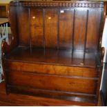 A close nailed boarded oak two seater box seat settle, having typical hinged compartment, width