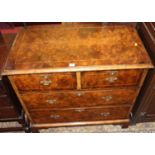 A William & Mary style figured walnut and further strung chest of two short over two long drawers,