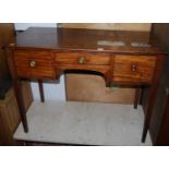 A 19th century mahogany kneehole three drawer dressing table on square tapering supports, width