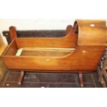 A Victorian mahogany child's rocking cradle on stand, length of cradle 95cm