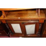 A Victorian faded rosewood(?) chiffoniere, having cushion frieze drawer over grille inset cupboard