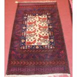 A Turkish woollen rug, the central field decorated with geometric cockerels, flowers and foliage