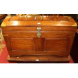 A contemporary Eastern hardwood brass bound and further strung hinged dome top trunk, having brass