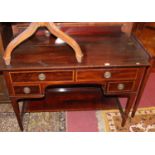 A circa 1900 mahogany and satinwood crossbanded ledgeback side table by Maple & Co. having four