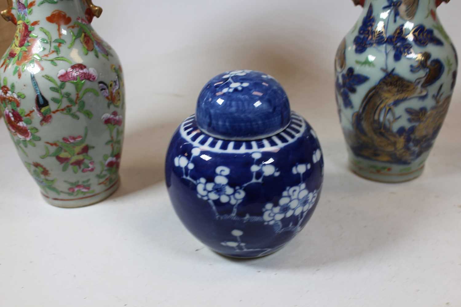 A pair of stoneware vases, each of baluster form, enamel decorated with various birds, butterflies - Image 6 of 13