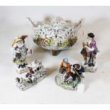 A pair of 20th century continental porcelain figures in the form of a lady and gent, he in