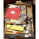 A box of miscellaneous loose and cased silver plated and steel flatwares
