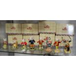 A collection of eight Royal Doulton Rupert the Bear figures, to include Banging on his drum RB17,