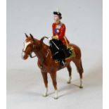 A Beswick model of HM Queen Elizabeth II mounted on Imperial Trooping the colour 1957, model No.