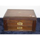 An Edwardian oak cutlery canteen, the hinged lid opening to reveal blue felt lined interior, with
