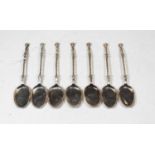 A set of seven Dutch silver ice cream spoons, each having a flattened oval bowl with spirally turned