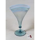 An early 20th century blue tinted vaseline glass cocktail glass of pinched form on a knopped stem
