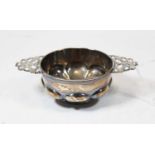 A George V silver porringer having shaped bowl and pierced twin handles, 5.4ozCondition report: