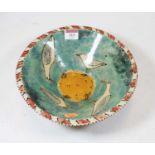 A studio pottery bowl, the centre decorated with seagulls on a blue ground, monogrammed RJ verso,