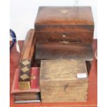 A 1920s walnut work box, having a hinged lid opening to reveal partitioned interior, above a