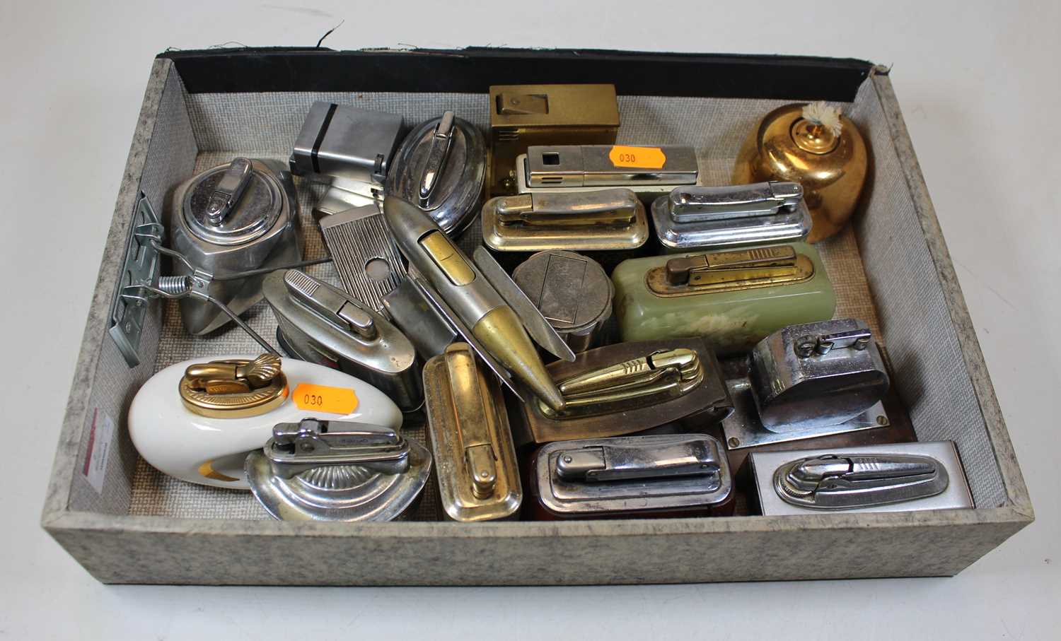 A collection of assorted table cigarette lighters to include chromed and brass novelty example in