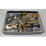 A collection of assorted table cigarette lighters to include chromed and brass novelty example in