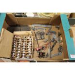 A collection of loose Meccano aeroplane parts and components