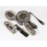 A collection of assorted Victorian and later silver backed hand mirrors, brushes, shoe horn etc