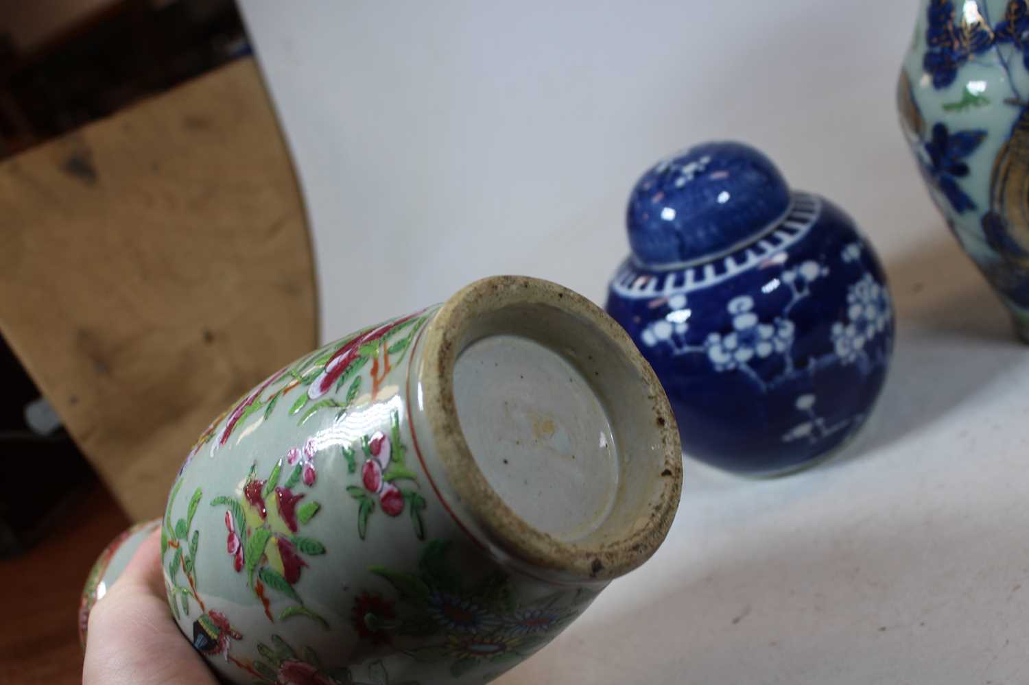 A pair of stoneware vases, each of baluster form, enamel decorated with various birds, butterflies - Image 5 of 13