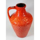 A large West German orange glazed pottery jug, h.43cm; together with various other West German