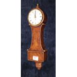 A modern wall clock in the form of a tavern type clock, having a burr walnut case with enamelled