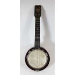 A mid 20th century Keech Banjolele No. A1212498, length 56cmCondition report: Split to headstock.